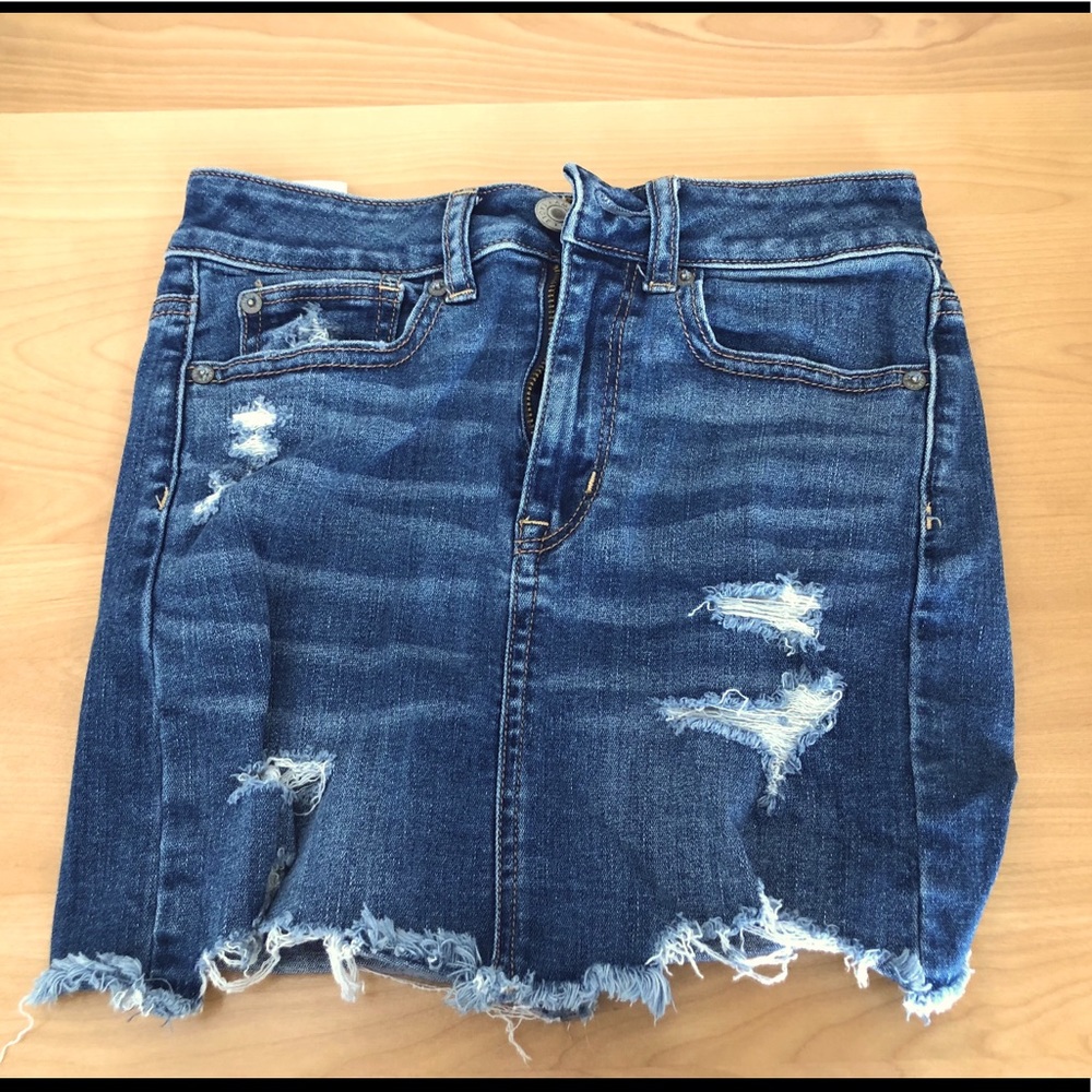 High waisted distressed denim skirt